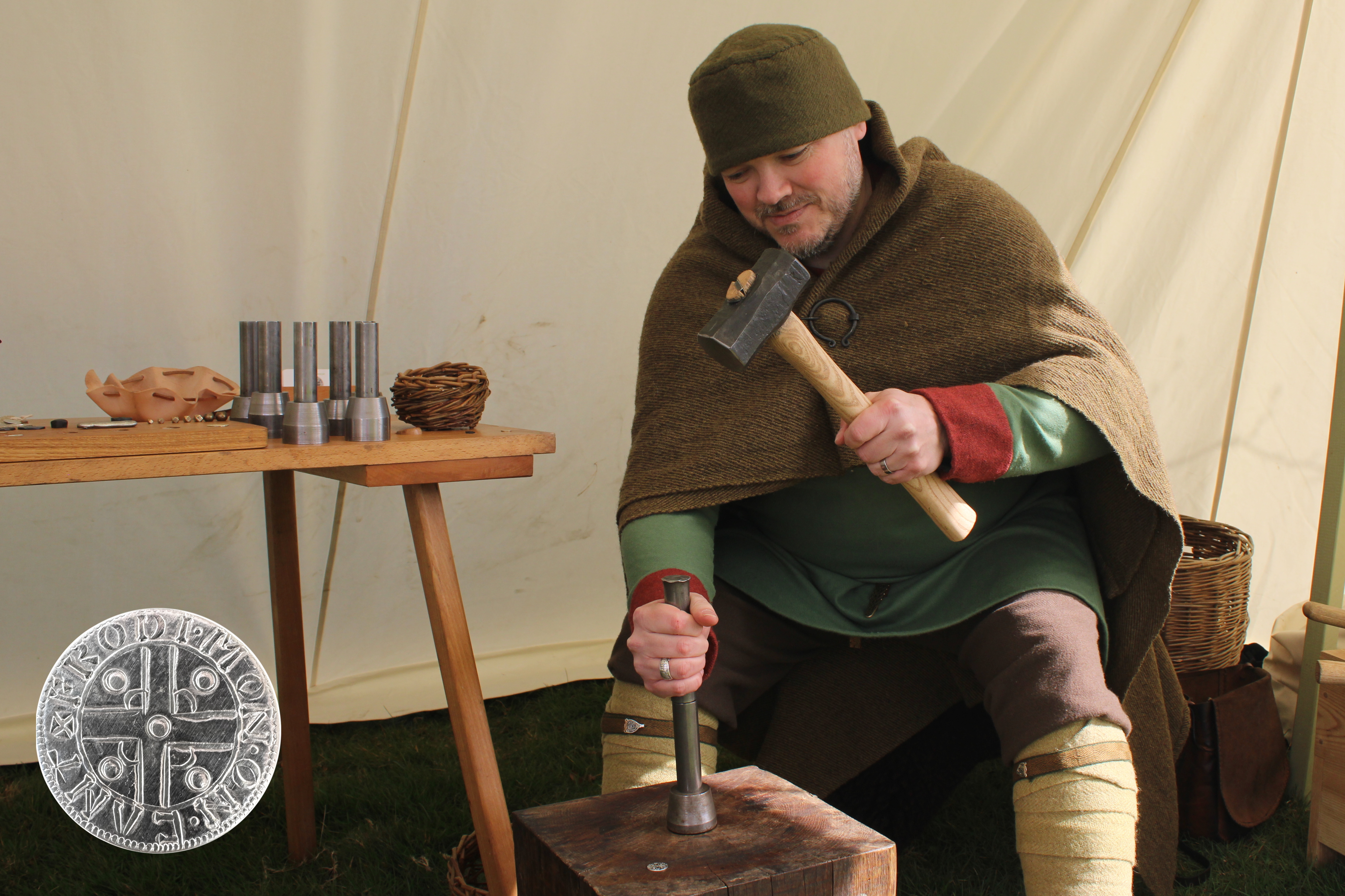 Visitor striking a coin at Frodi's have-a-go display